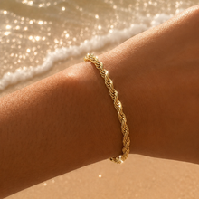 Load image into Gallery viewer, Gold Rope Twist Chain Bracelet
Waterproof
Tarnish resistant
Stainless steel
Hypoallergenic
Add a touch of elegance to your wrist with our Gold Rope Twist Chain Bracelet! The intricate twist design creates a stunning visual that’s both classic and modern. Perfect for stacking or wearing solo, this bracelet is a versatile piece that elevates any outfit! 


